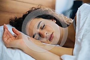 Beautiful young woman sleeping in bed.