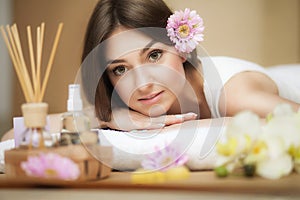 Young beautiful woman on the spa. Aroma oil and butter. Nice look. The concept of health and beauty. Better In the spa salon.