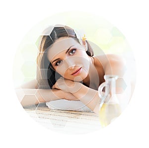 Young and beautiful woman in spa. Collage with honeycomb tiles. Healing and massaging concept.