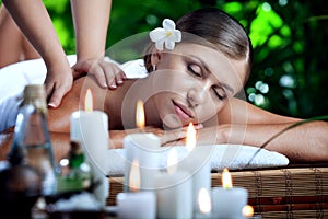 Young beautiful woman in spa environment.