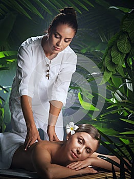 Young beautiful woman in spa environment