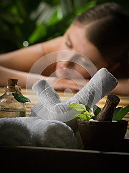 Young beautiful woman in spa environment.