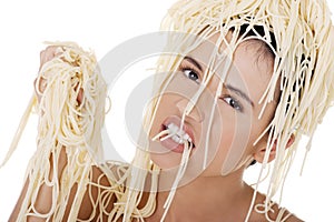 Young beautiful woman with spaghetti noodles