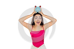 Young beautiful woman standing with piggy bank money box