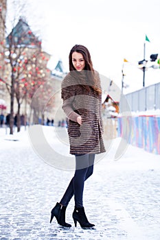 Young beautiful woman in stylish mink coat