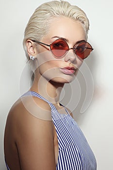 Young beautiful woman with stylish sunglasses