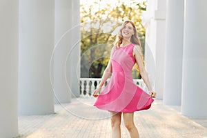 Young beautiful woman, in a summer dress, posing. Valentine`s Day. Holiday for a woman. March 8