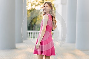 Young beautiful woman, in a summer dress, posing. Valentine`s Day. Holiday for a woman. March 8