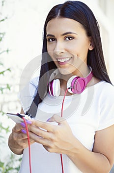 Young beautiful woman summer portrait with mobile phone