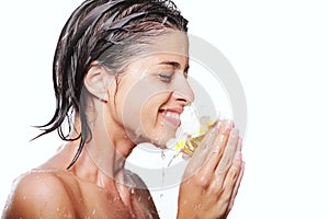 Young beautiful woman taking a shower