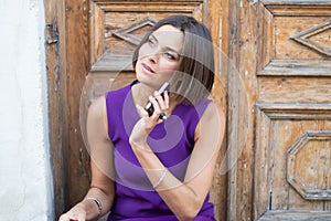 Young beautiful woman talking on the phone