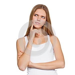 Young beautiful woman thinking looking to the side at blank copy space, isolated over white background