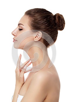 Young beautiful woman touching her neck