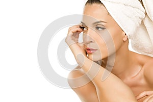 Young beautiful woman with towel on her head