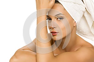 Young beautiful woman with towel on her head