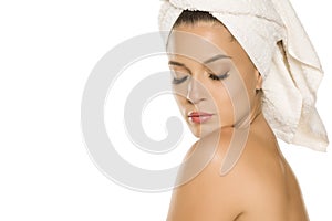 Young beautiful woman with towel on her head