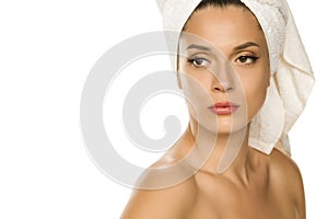 Young beautiful woman with towel on her head