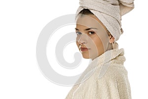Young beautiful woman with towel on her head