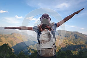 Young beautiful woman traveler enjoys mountain, beautiful landscape and active lifestyle. Sri Lanka - Ceylon Island