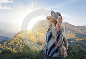 Young beautiful woman traveler enjoys mountain, beautiful landscape and active lifestyle. Sri Lanka - Ceylon Island