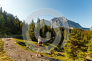 Young beautiful woman traveler , mountains Alps background,