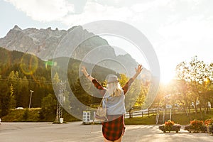 Young beautiful woman traveler , mountains Alps background,