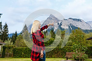 Young beautiful woman traveler , mountains Alps background,