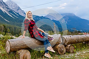 Young beautiful woman traveler , mountains Alps background,