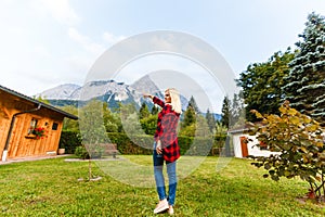 Young beautiful woman traveler , mountains Alps background,