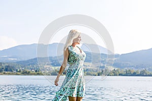 Young beautiful woman traveler , mountains Alps background,