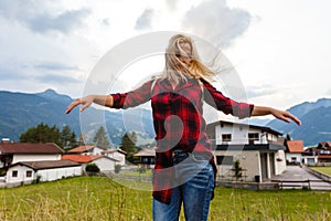 Young beautiful woman traveler , mountains Alps background,