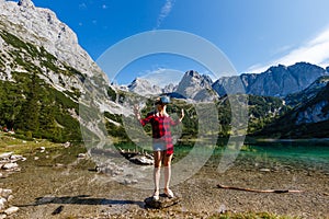 Young beautiful woman traveler , mountains Alps background,