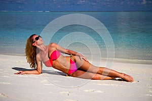 Young beautiful woman on a tropical beach