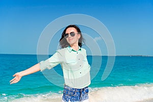 Young beautiful woman on tropical beach vacation