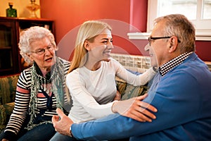 Young beautiful woman visit her grandparents