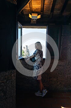 Young beautiful woman visits the sights of the Republic of San Marino, Italy