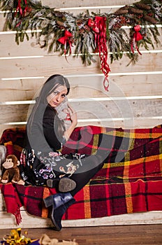 Young beautiful woman waiting christmas at home