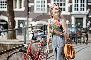 Woman with bicycle in Amsterdam city