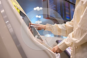 Young beautiful woman walking with suitcase , check in at International airport , vacation travel and transportation concept