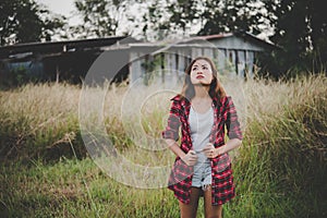 Young beautiful woman walking through in summer field, Freedom e