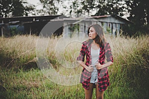 Young beautiful woman walking through in summer field, Freedom e