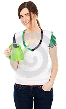 Young beautiful woman with watering can