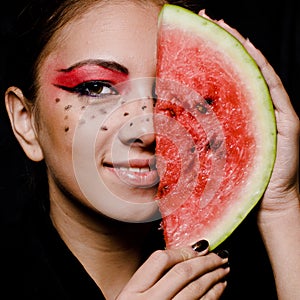 Young beautiful woman and watermelon portrait