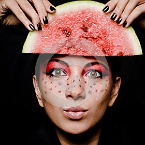 Young beautiful woman and watermelon portrait