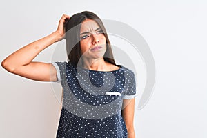 Young beautiful woman wearing blue casual t-shirt standing over isolated white background confuse and wonder about question