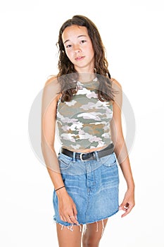 Young beautiful woman wearing denim skirt camouflage t shirt over isolated white background