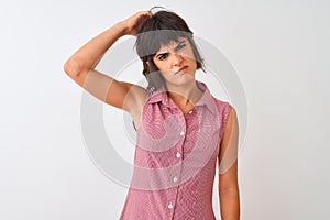 Young beautiful woman wearing red summer shirt standing over isolated white background confuse and wonder about question