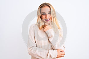 Young beautiful woman wearing turtleneck sweater standing over isolated white background looking confident at the camera smiling