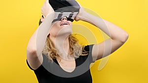 Young beautiful woman wearing a VR virtual reality headset