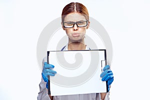 Young beautiful woman on white isolated background holds a syringe, doctor, medicine